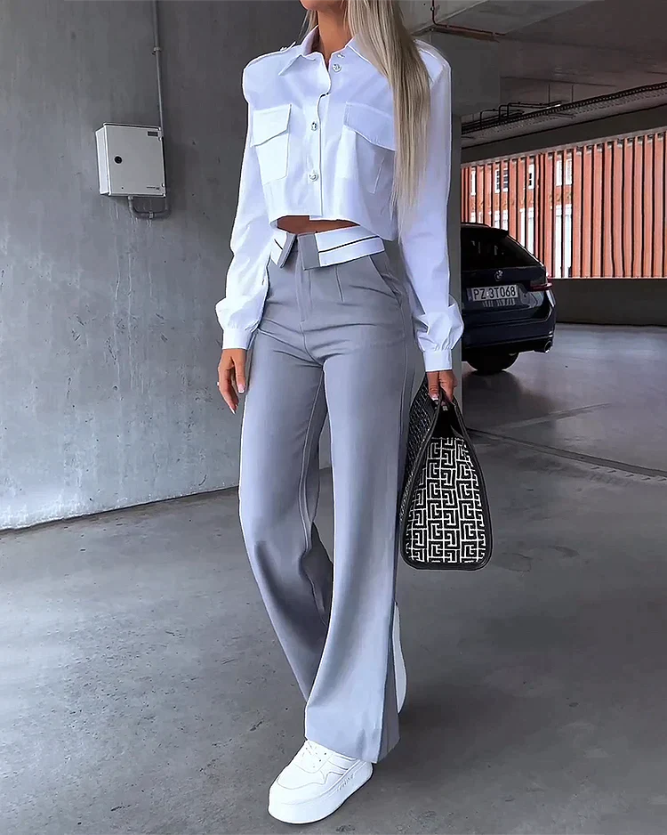 Tweedelig pak met broek en reverstop met lange mouwen