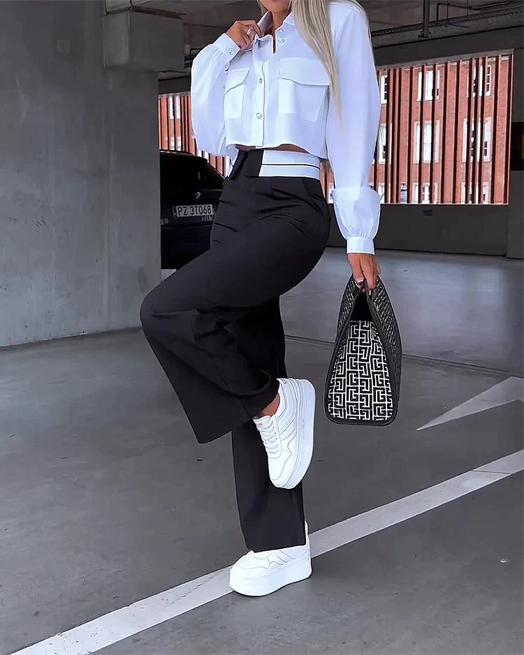 Tweedelig pak met broek en reverstop met lange mouwen